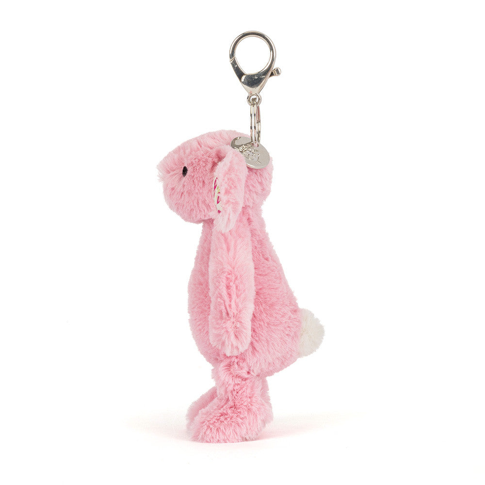 Pink plush bunny keychain on a white background