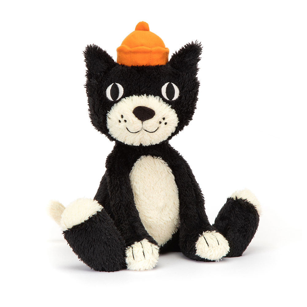 A plush toy resembling a black and white cat with a orange hat, featuring soft tufty fur and large stitched paws.