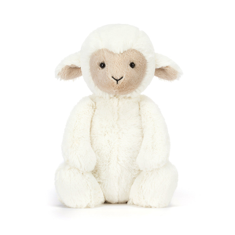 White plush lamb toy with a soft texture on a white background