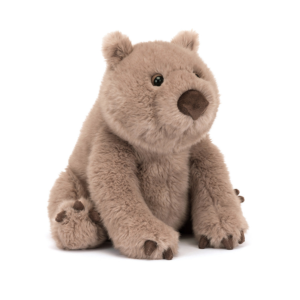 A plush toy resembling a wombat, with a brown color scheme and a soft, textured surface.