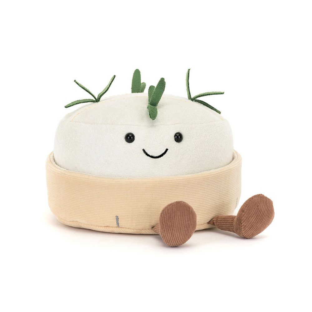 Plush toy camembert with a smiling face on a white background