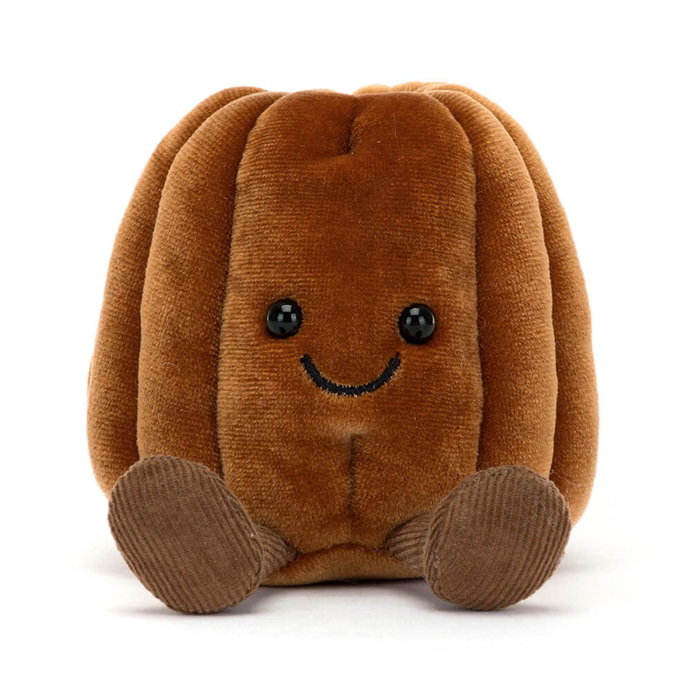 Brown plush toy with a smiling face on a white background