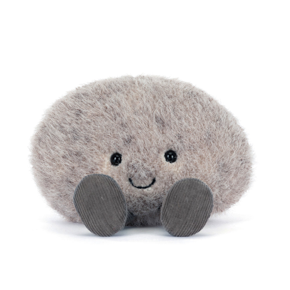 Plush toy resembling a stone on a white background