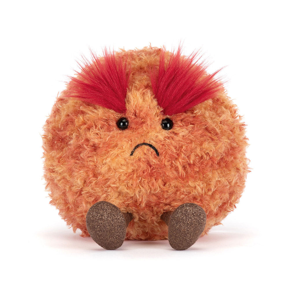 Plush toy  planet Mars with red spines on a white background