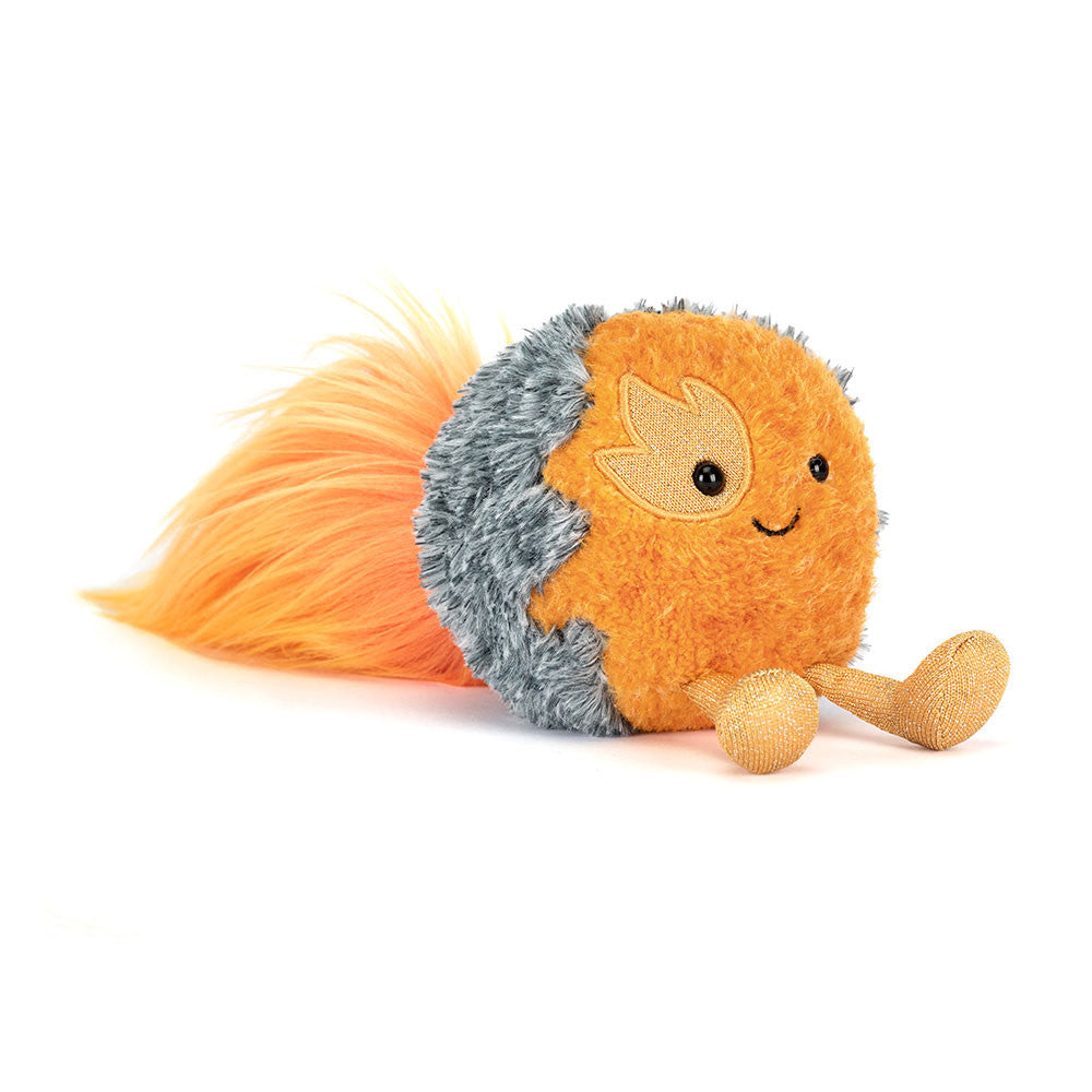 Plush toy space comet with a smiling face on a white background