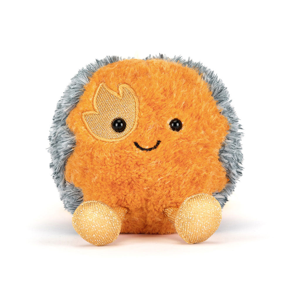 Plush toy space comet with a happy expression on a white background