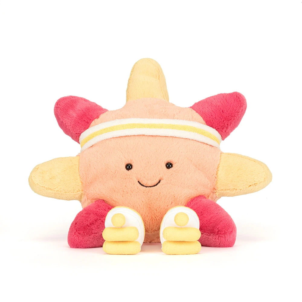 Plush toy starfish with a smiley face on a white background