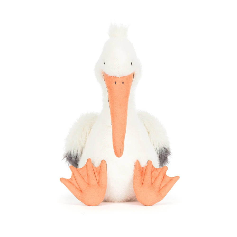 Stuffed pelican toy with a white body, orange beak, and feet on a white background