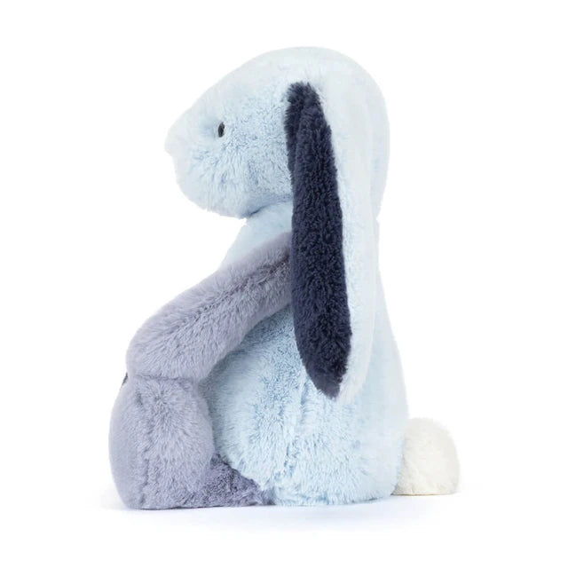 Plush toy rabbit with a white face and dark gray ears on a white background