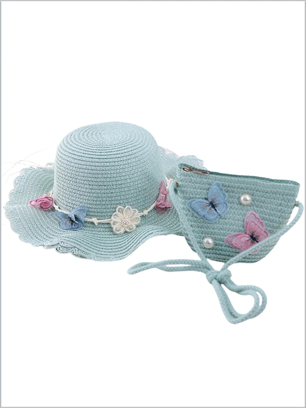 Light blue straw hat with decorative flowers and butterflies on a white background