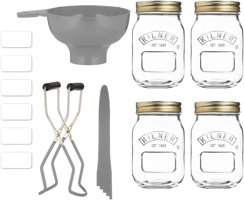 Kilner preserving jars with lids, tongs, and a funnel on a white background