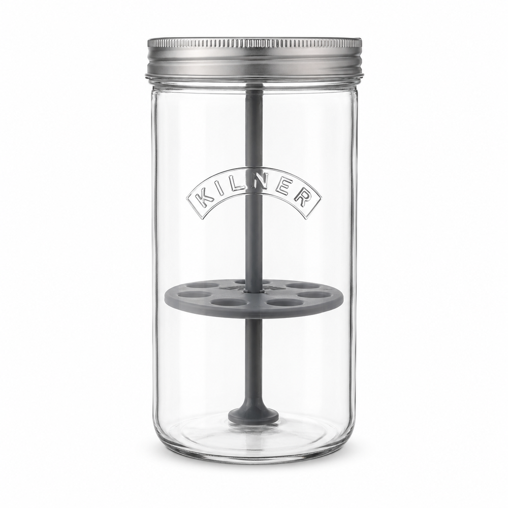 Clear glass jar with metal lid and gray interior on a white background, featuring the Kilner brand.