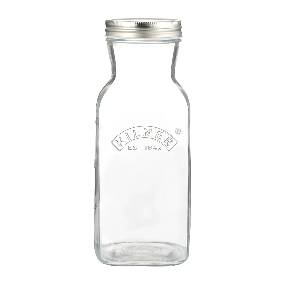 Clear glass bottle with silver lid on a white background, featuring the Kilner logo.