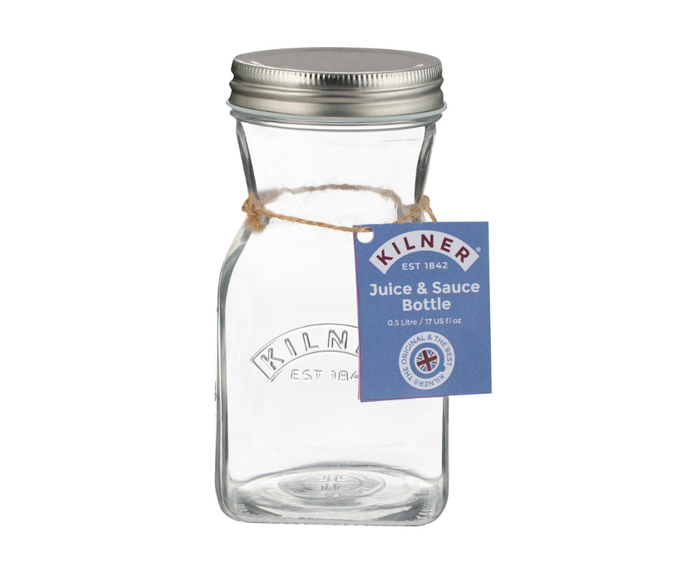 Clear glass bottle with metal lid and Kilner label on a white background