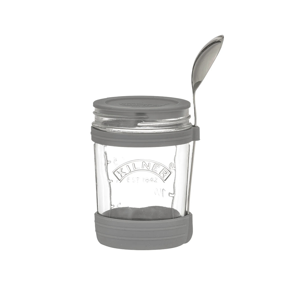 Clear Kilner jar with gray lid and base on a white background