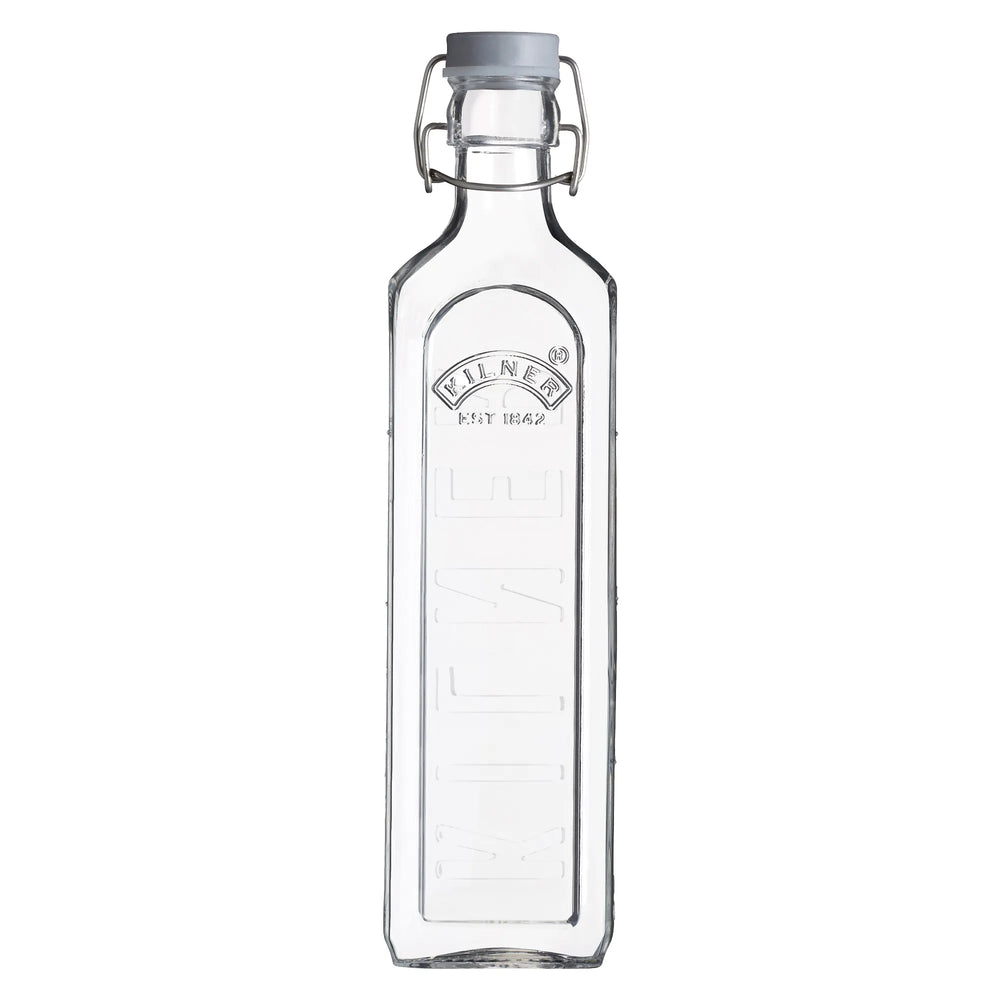 Clear glass bottle with a metal cap on a white background