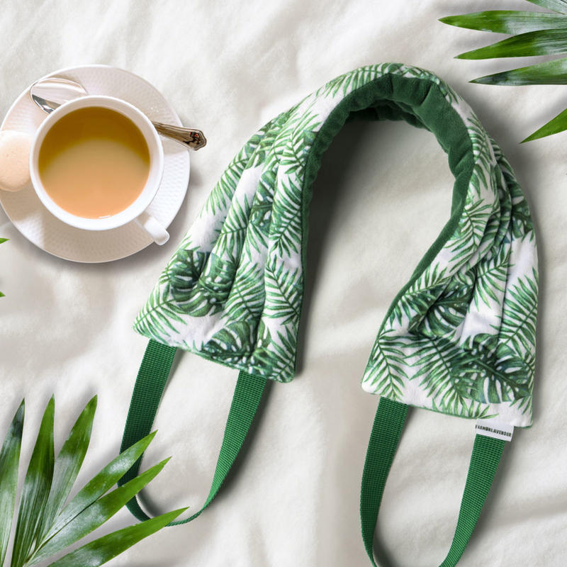 Neck pillow with tropical leaf pattern