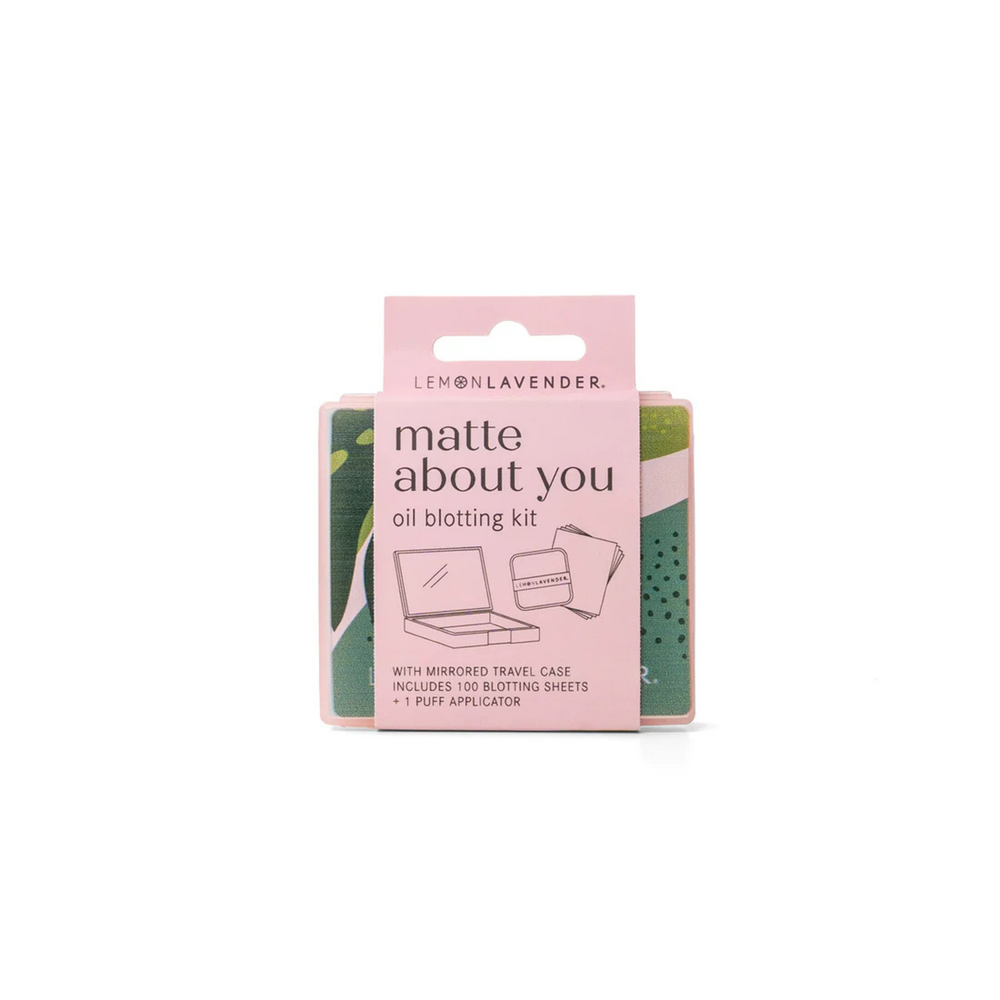 Oil blotting kit packaging with pink and green design on a white background