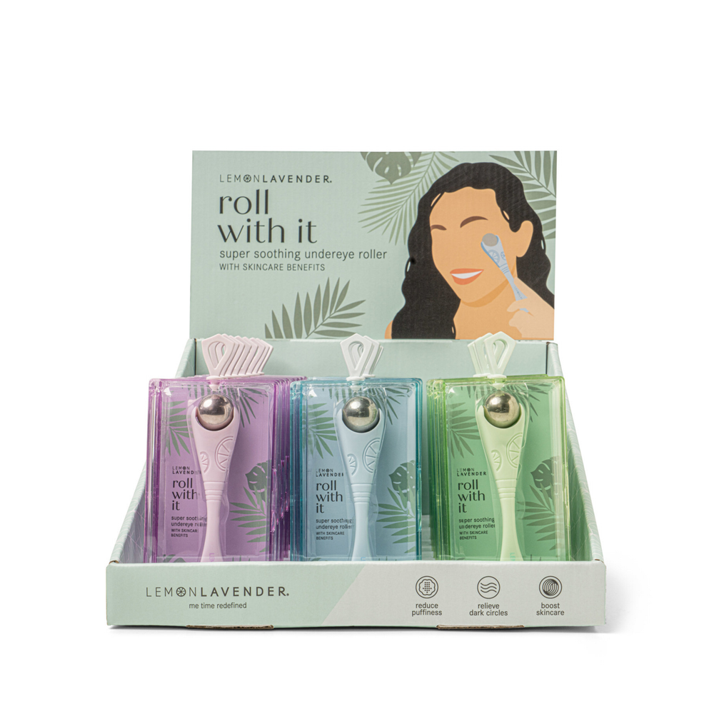 Lemon Lavender roll with it packaging with three undereye rollers and a woman using one.