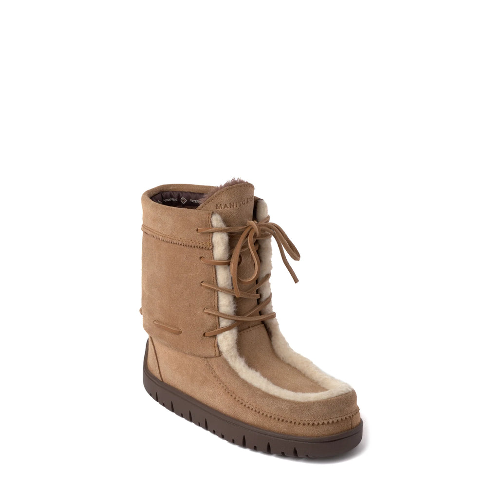 Tan suede boot with a flat brown sole and faux fur lining, featuring lace-up detailing on the front. 
