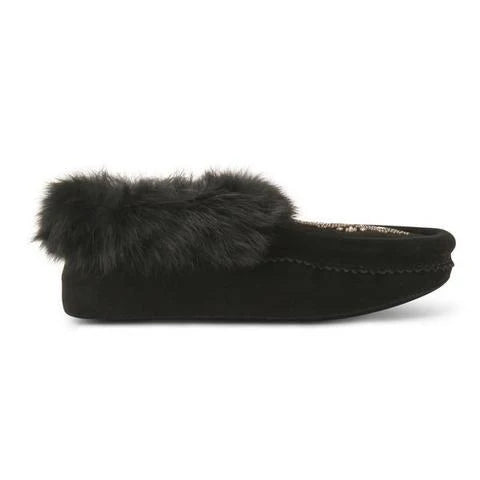 A black moccasin shoe with a soft, fluffy fur trim around the opening, and intricate stitching along the side.