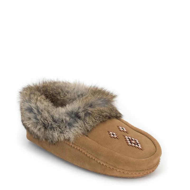 A oak moccasin slipper with a fluffy fur lining and a beaded snowflake design on top