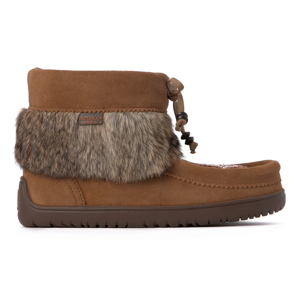 Oak suede ankle boot with faux fur trim and waterproof label. Brown rubber sole with ridges; lace-tied bow adds a cozy and stylish touch.