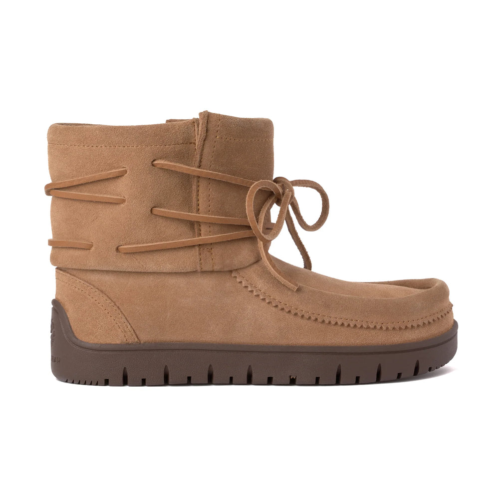 Light brown suede ankle boot with wraparound laces and a bow on the side. It has a moccasin-style toe and a dark brown rubber sole.