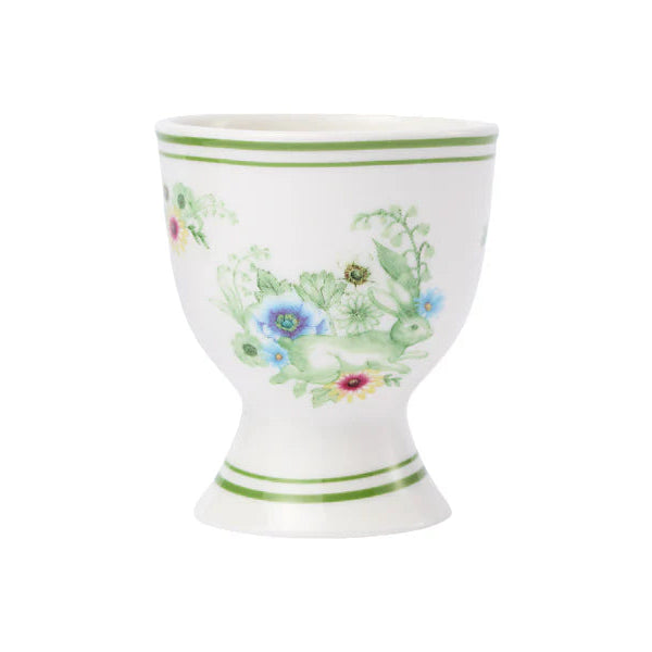 Decorative ceramic egg cup with floral design on a white background