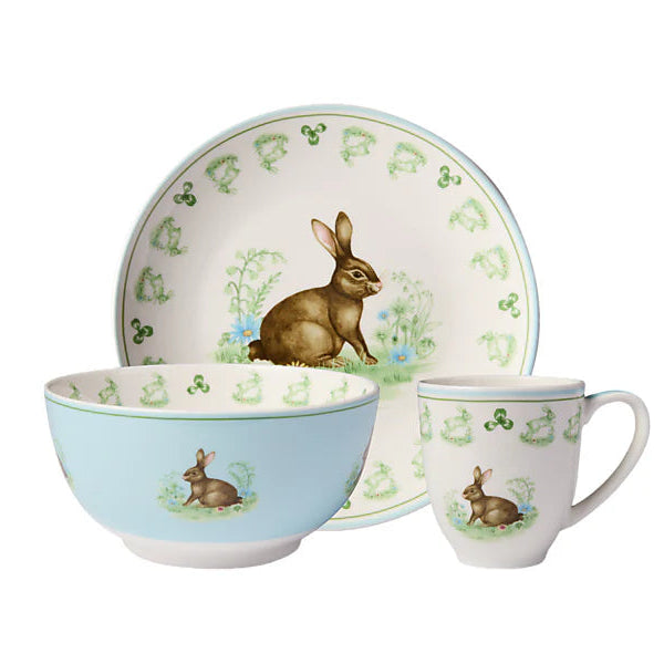 Set of ceramic dishes with rabbit illustrations on a white background