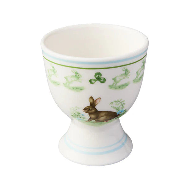 Porcelain egg cup with rabbit design on a white background