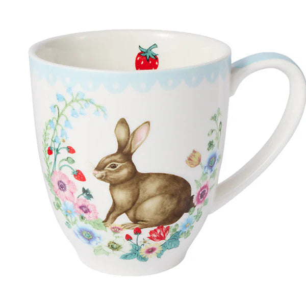 Mug with a rabbit and floral design on a white background