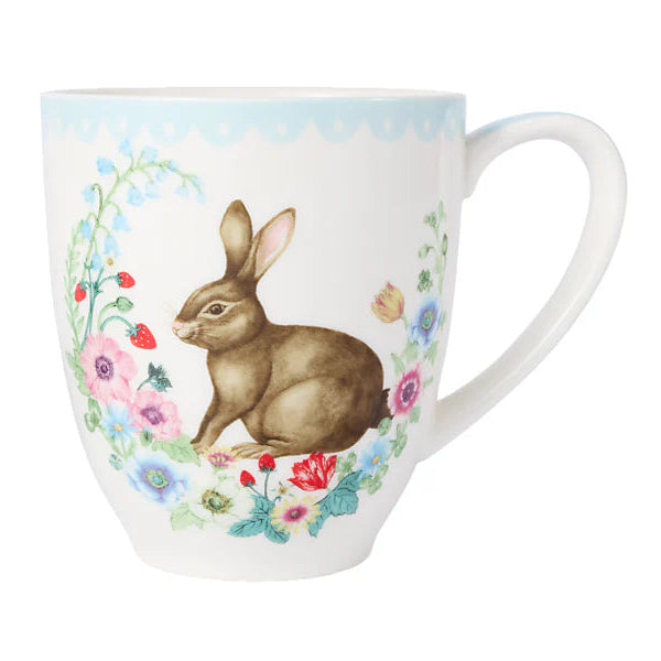 Mug with a rabbit and floral design on a white background