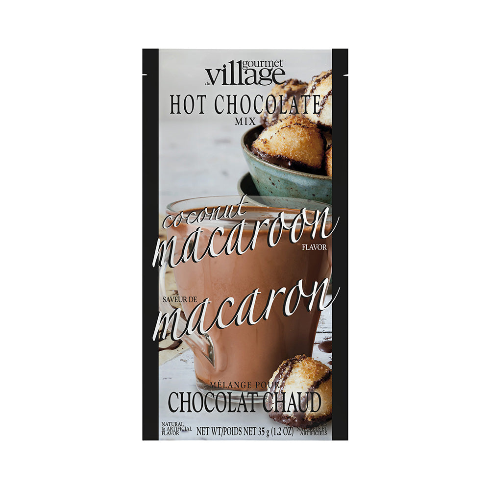 Pouch of coconut macaroon flavor hot chocolate mix labeled "Gourmet Village." Image shows a warm, inviting mug and macaroons in soft tones.