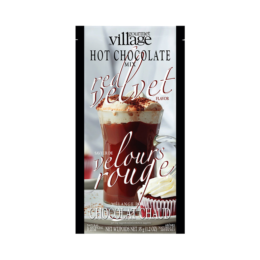 Gourmet Village Red Velvet Hot Chocolate Mix packet with an image of a creamy hot chocolate topped with whipped cream and chocolate shavings.