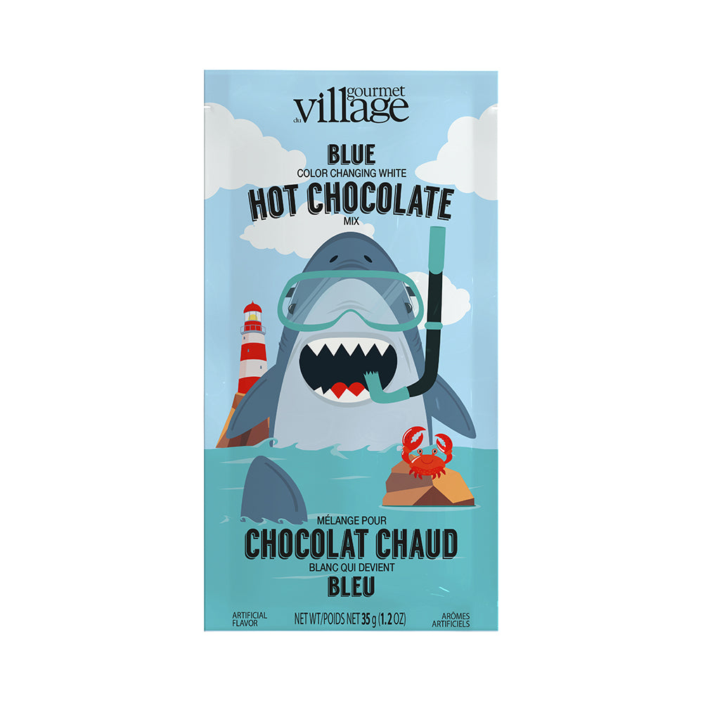 Cartoon shark wearing snorkel and goggles in ocean with lighthouse and crab on buoy. Text: "Blue color changing white hot chocolate mix." Playful tone.