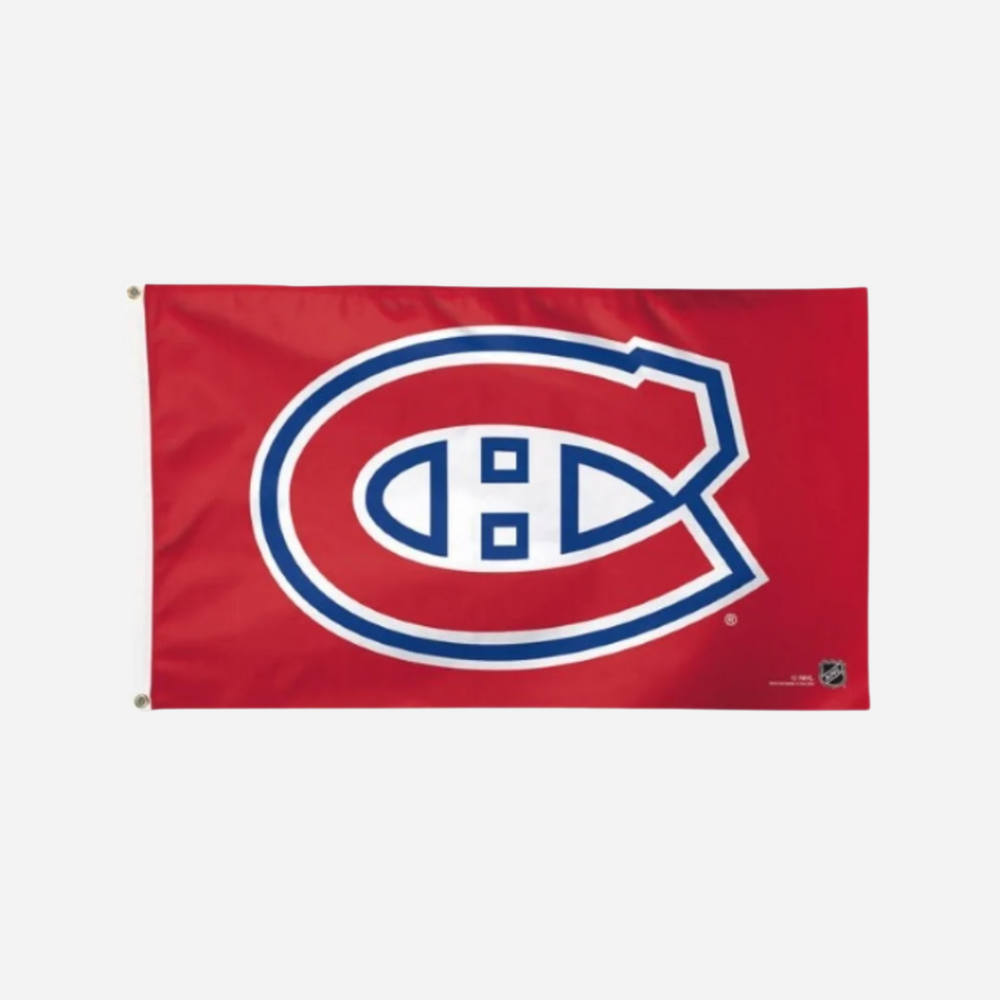 A rectangular flag with a red background featuring the white and blue logo of the Montreal Canadiens hockey team.