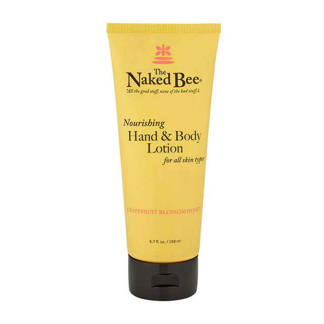 A yellow tube of The Naked Bee Grapefruit Blossom Honey Hand & Body Lotion with a black cap.
