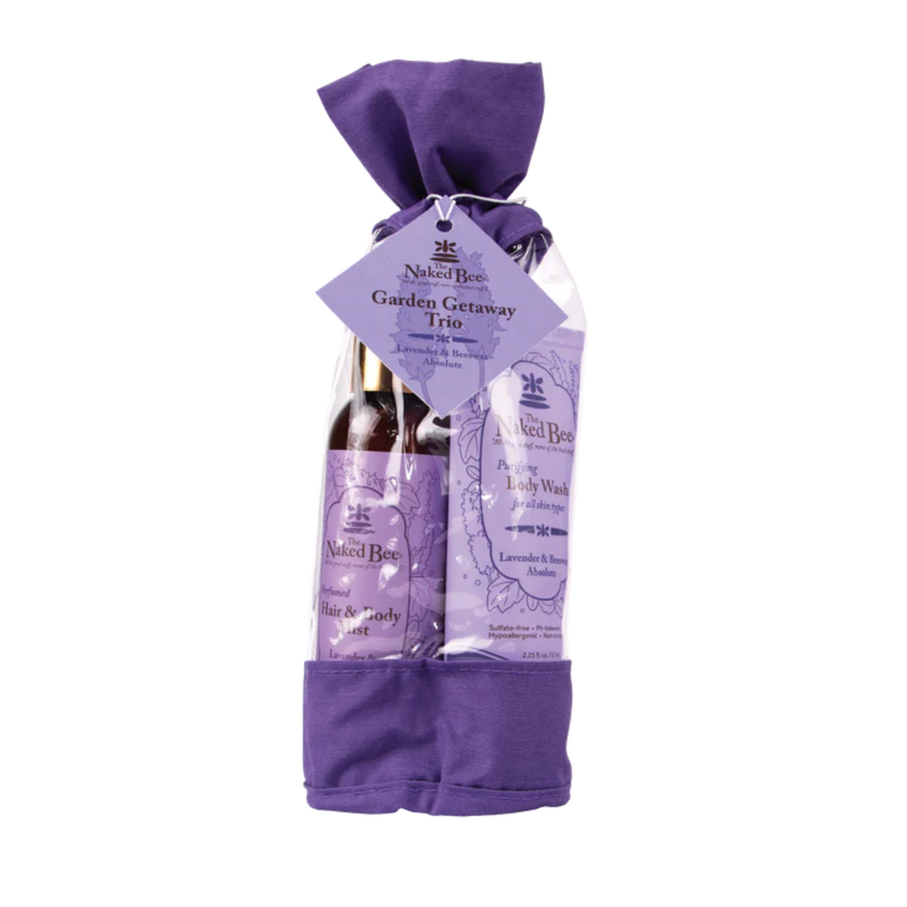 Purple gift set with body wash, soap, and towel on a white background
