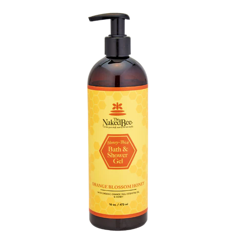 A bottle of Naked Bee Orange Blossom Honey Bath & Shower Gel, 16oz size, with a pump dispenser, and yellow label with orange blossom graphics.