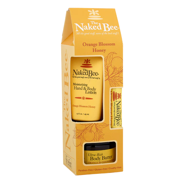 A gift set box containing Orange Blossom Honey hand and body lotion, body butter, and lip balm by The Naked Bee.