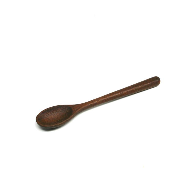 Dark-wood spoon on a white background