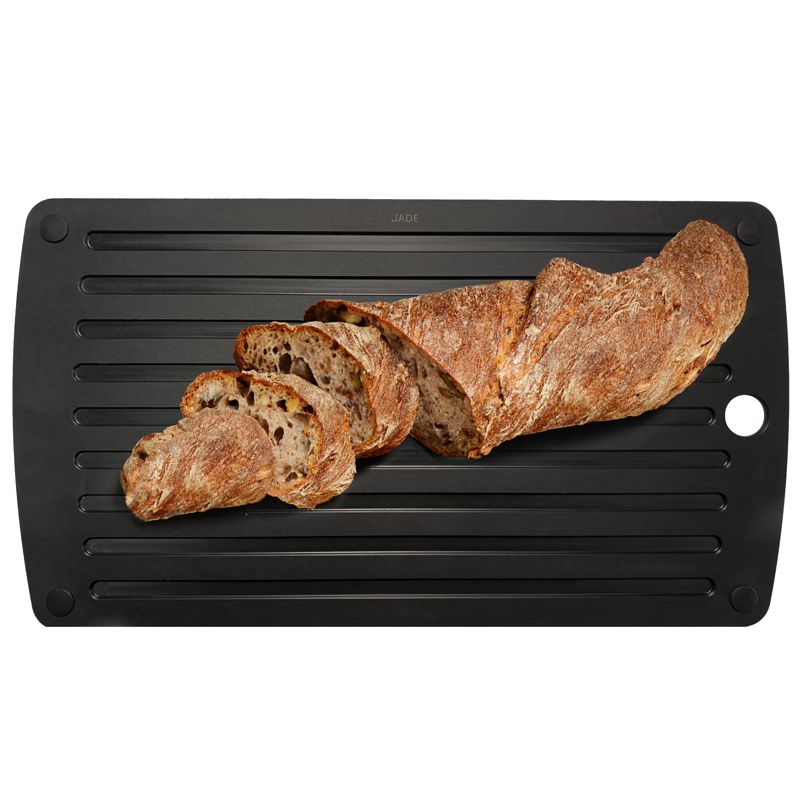 Black board with bread on a white background