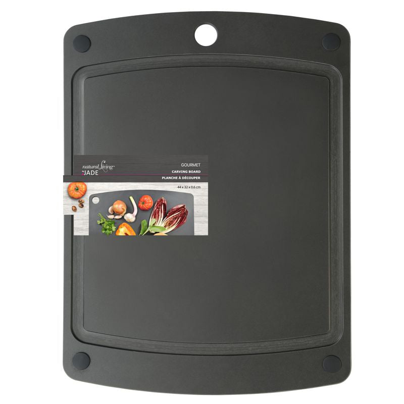 A black jade carving board with grooved edges and a hole for hanging. It has product information and branding on the top edge.