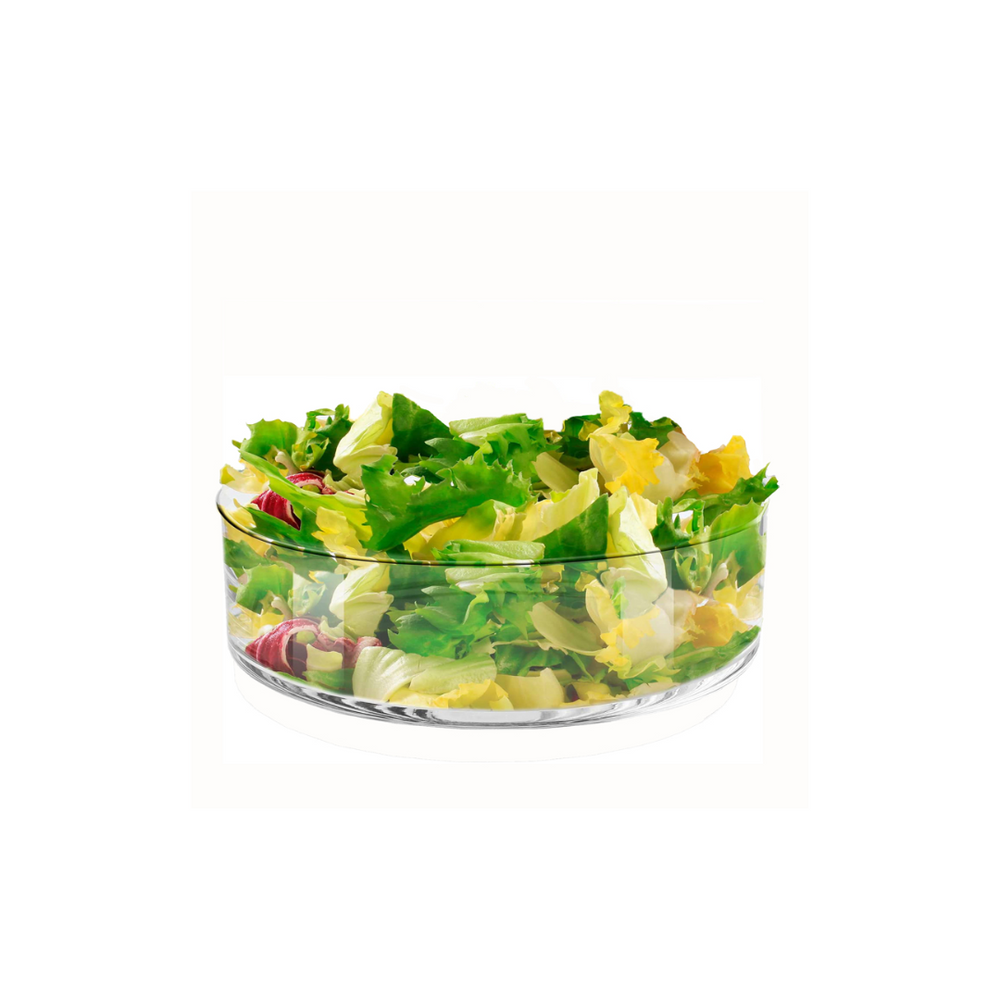 Shallow bowl full of greens on a white background.