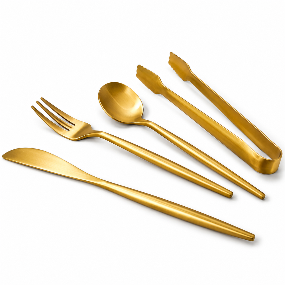 Four gold utensils on a white background.