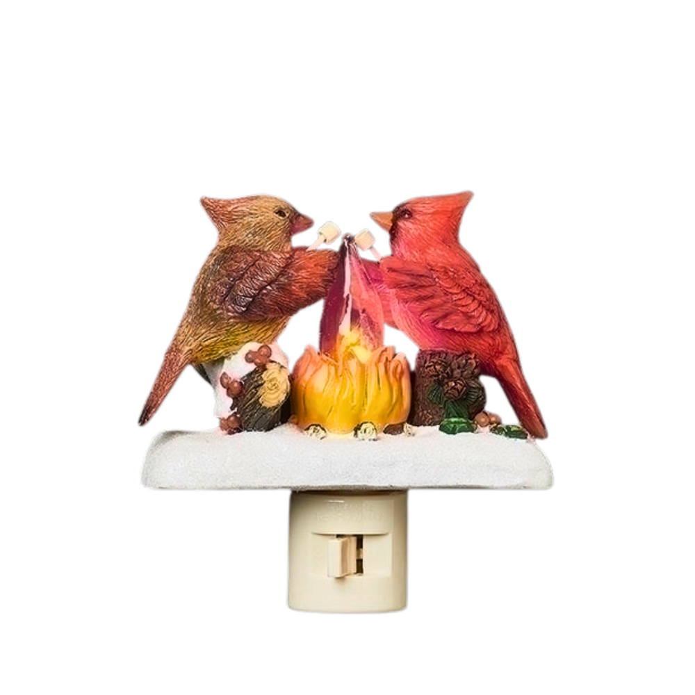 Cardinal bird night light with two cardinals around a fire on a white background