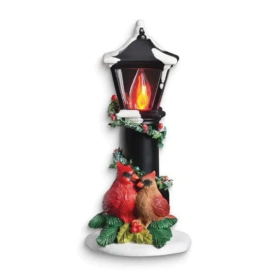 Decorative lantern with two cardinals and a glowing flame on a white background