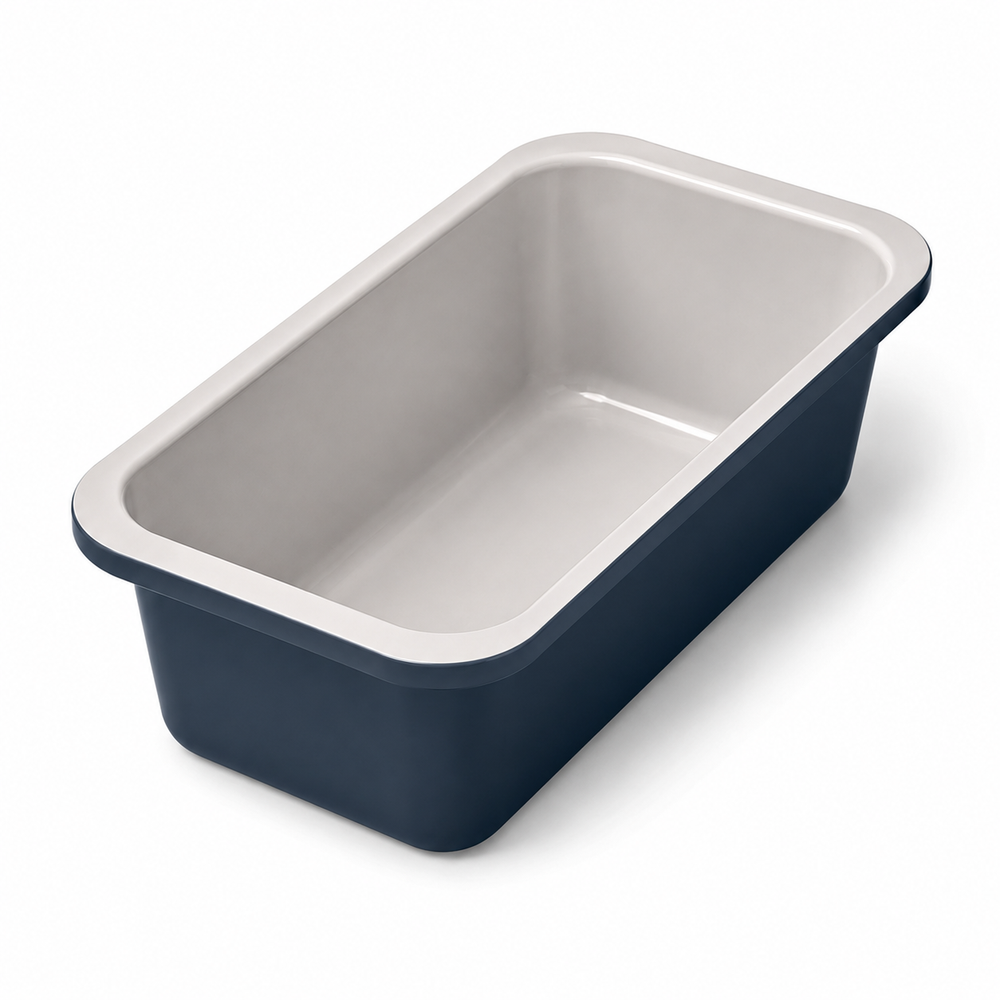 A rectangular baking pan with a dark navy blue exterior and a light gray interior, shown from an elevated angle on a white background.