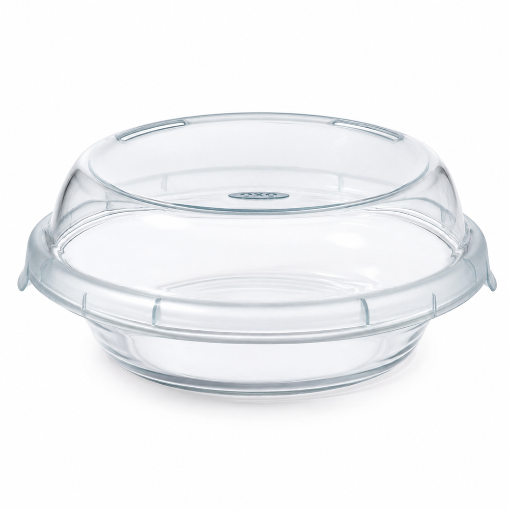 Clear glass round baking dish with a matching clear glass lid, shown on a white background.